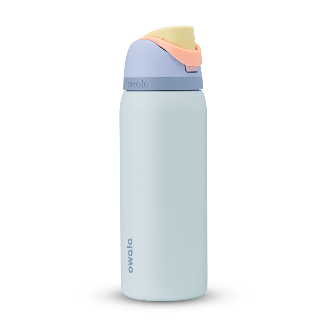 Full profile shot of the 32oz Cloud 9 FreeSip water bottle, featuring a vibrant blend of blue, yellow, and salmon colors.